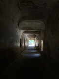 Fototapeta Desenie - View through a tunnel on at road
