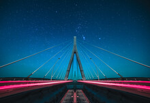 Long Exposure From The Middle Of The Suspension Bridge, Passage Of Vehicles And Motion Blur Effect, Travel