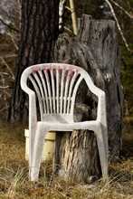 Photo Of A White Plastic Chair Outdoors