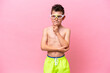 © luismolinero - Little caucasian boy wearing a diving goggles isolated on pink background having doubts and thinking