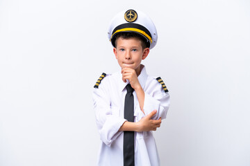 Wall Mural - Little airplane pilot boy isolated on white background having doubts and thinking