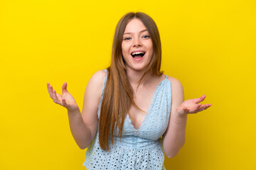 Young caucasian woman isolated on yellow background with surprise facial expression