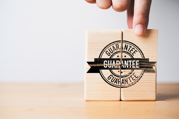 Fototapete - Hand assembly guarantee tag label on wooden cube block for the best quality of product and service to customer concept.