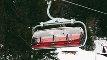 Winter Ski Resort, Cable Car With Red Seats And A Hood On Them, Jahorina, Bosnia And Herzegovina.