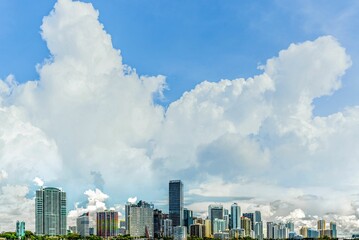 Beautiful cityscape view with high and modern buildings against a cloudy sky in Miami, USA