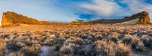Panoramic View Of Fort Rock Against Dried Shrubs In A Desert In Oregon, USA At Golden Hour