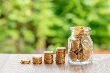 gold coin stack money saving concept. rows of coin on green bokeh background. money matters tips to investment and business financial banking for Financial save money concept.