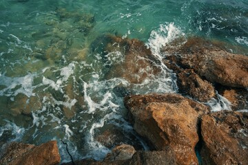 water meets stones on the beach