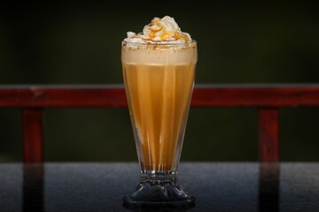 Sticker - Glass of vanilla milkshake on marble table