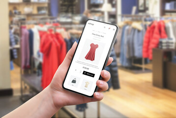 Search for clothes online in a clothing store. Color and size selection on app. Modern e-commerce website on a mobile phone in a woman's hand