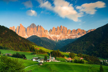 Sunset Over The Odle Peaks And The Alpine Village Of Santa Magdalena In Spring, Funes Valley, South Tyrol, Italy