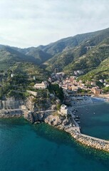 Poster - Coastal village of Monterosso al Mare, Cinque Terre National Park with blue sea and boats in harbor