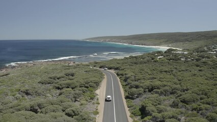 Canvas Print - Beautiful shot of a car driving on a long highway