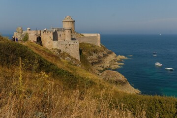 Sticker - View of old castle Fort La Latte is located on peninsula. Popular travel destination at French coast