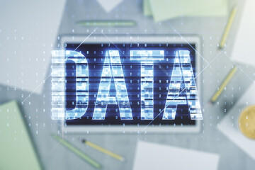Wall Mural - creative data word sign and modern digital tablet on background, top view. multiexposure
