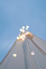 Sticker - Vertical shot of white pillar with white glowing bulbs