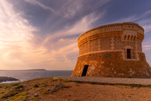 View Of Fornelles Tower Fortress And Mediterrainean Sea At Sunset In Fornelles, Fornelles, Menorca, Balearic Islands, Spain