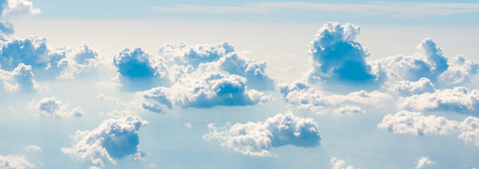 Wall Mural - blue sky with white clouds panorama, above aerial view from plane, nature blue sky background