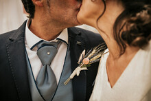 Newlywed Couple Kissing To Celebrate The Ceremony