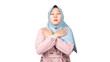 Asian Muslim women wearing pink shirts and blue headscarves are crossing their arms across their chests symbolizing calm, patience, self-restraint.