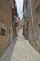 Poster - Vertical shot of a narrow street in Caiazzo, Italy