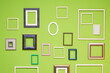 Leinwandbild Motiv Wooden frames of different sizes and shapes on the green wall