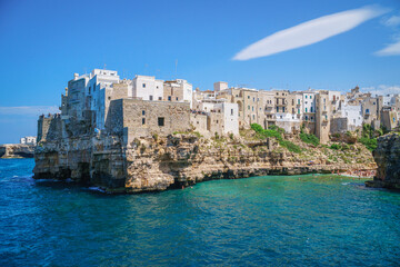 Wall Mural - Coast of Polignano a Mare and beach with tourists, Puglia, Italy