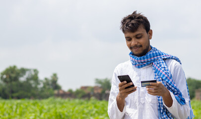 young farmer using internet for online payment