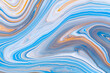 Fluid art texture. Backdrop with abstract swirling paint effect. Liquid acrylic artwork with beautiful mixed paints. Can be used for interior poster. Orange, blue and navy blue overflowing colors.