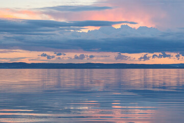 Wall Mural - Vibrant sunset sky over Tuggerah Lake from Canton Beach in Toukley, NSW Australia