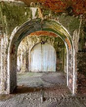 Nested Arched Doorways Leading To White Wooden Doors