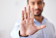 © Charlize D/peopleimages.com - Closeup of the hand of a business man showing stop, saying no or not accepting a deal in an office at work. Male corporate worker making hand gesture not agreeing to a statement or refusing an answer