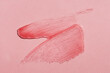 © colnihko - Smears of transparent shining lip gloss on a pink background