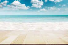 Empty Wooden Table Top On Beautiful White Sand Beach And Blur Beautiful Cloud On Blue Sky At Sea