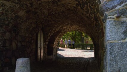 Wall Mural - Stone arch tunnel passage through thick fortified wall of ancient fort