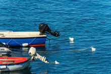 Close-up Of A Small Group Of Outboard Motor Boats Moored In The Port With Buoys And Ropes. Gulf Of La Spezia, Mediterranean Sea, Liguria, Italy, South Europe.