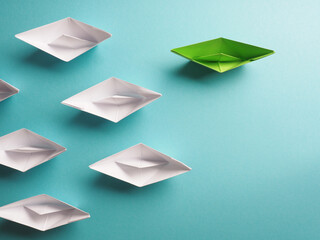 Wall Mural - New ideas, creativity and various innovative solutions or leadership, ecology concept with paper boats