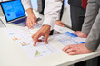 © Robert Kneschke - Business people in meeting analyzing graphs