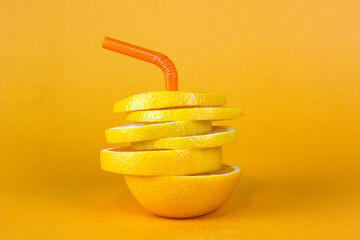 Wall Mural - Lemon fruit slice in layers isolated on yellow background. Juicy lemon sliced for fruits advertising design