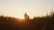 © Acronym - Farmer and his son in front of a sunset agricultural landscape. Man and a boy in a countryside field. Fatherhood, country life, farming and country lifestyle.