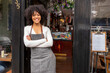 © Cultura Creative - UK, London, Portrait of smiling cafe owner at doorway