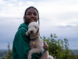 © Cultura Creative - Portrait of teenage (16-17) boy holding dog