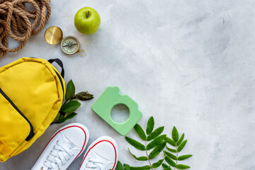 Flatlay with hiking backpack and sneakers. Summer camp concept