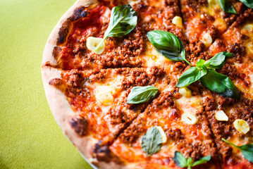 Wall Mural - tasty bolognese pizza with fresh basil