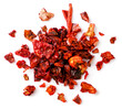 Heap of dried red pepper on a white background. top view