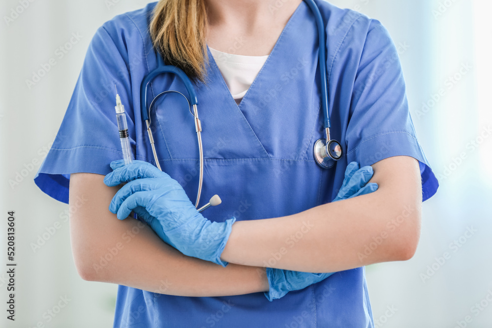Doctor with syringe  in clinic