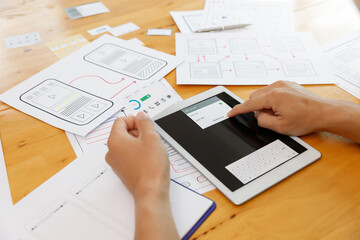 Wall Mural - ux ui concept, graphic designers work together with ux ui designer planning application template lay