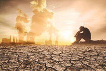 Concept Of Global Warming And Drought. People Are Sitting In Despair Because Of The Drought. A World Without Water
