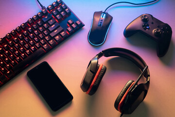 Gamer work space concept. gaming set up. top view of a gaming gear, keyboard, mouse, gamepad, joystick