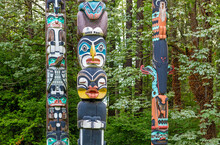Native Indigenous First Nations Totem Poles In Stanley Park Of Vancouver, British Columbia, Canada.